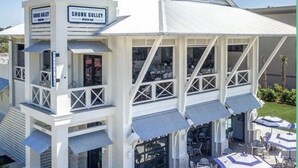 A coastal restaurant with outdoor seating and a covered patio area. - 30A Cottage, Walk to Beach, 2 Pools, Bikes&Chairs (Santa Rosa Beach)