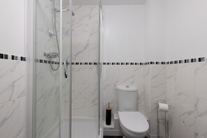 Shower, hair dryer, towels, soap