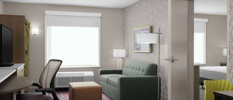 Habitación de hotel con escritorio, silla de oficina, sofá y cama.