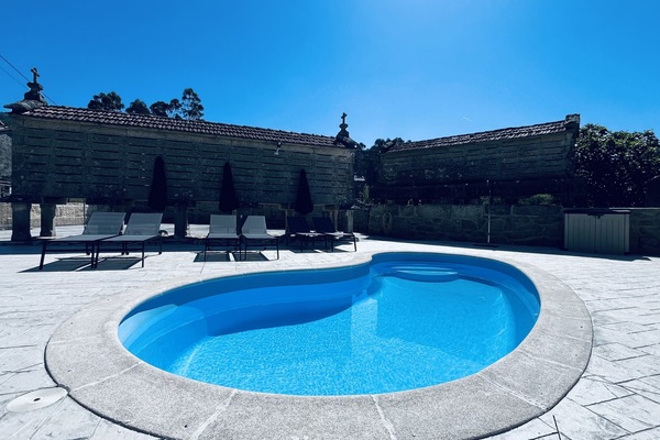 Seasonal outdoor pool, open 10:00 AM to 10:00 PM, pool umbrellas