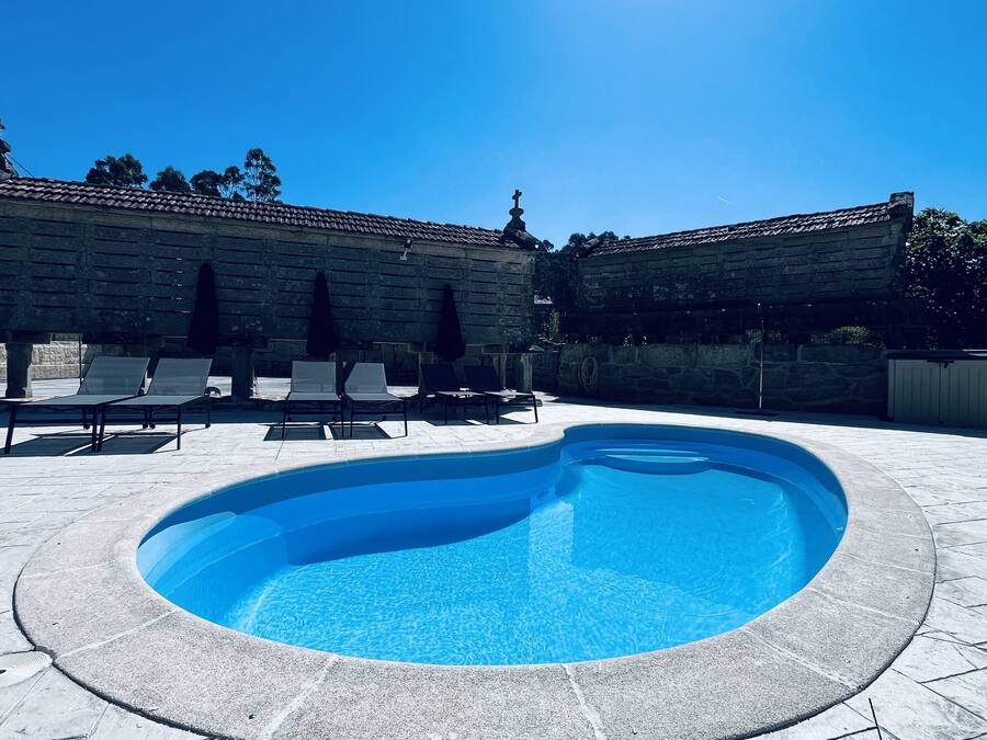 Seasonal outdoor pool, open 10:00 AM to 10:00 PM, pool umbrellas