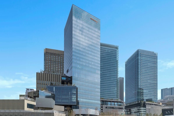 A modern high-rise building with a glass facade and a prominent 'concept' logo at the top. - Canopy By Hilton Osaka Umeda (Osaka)