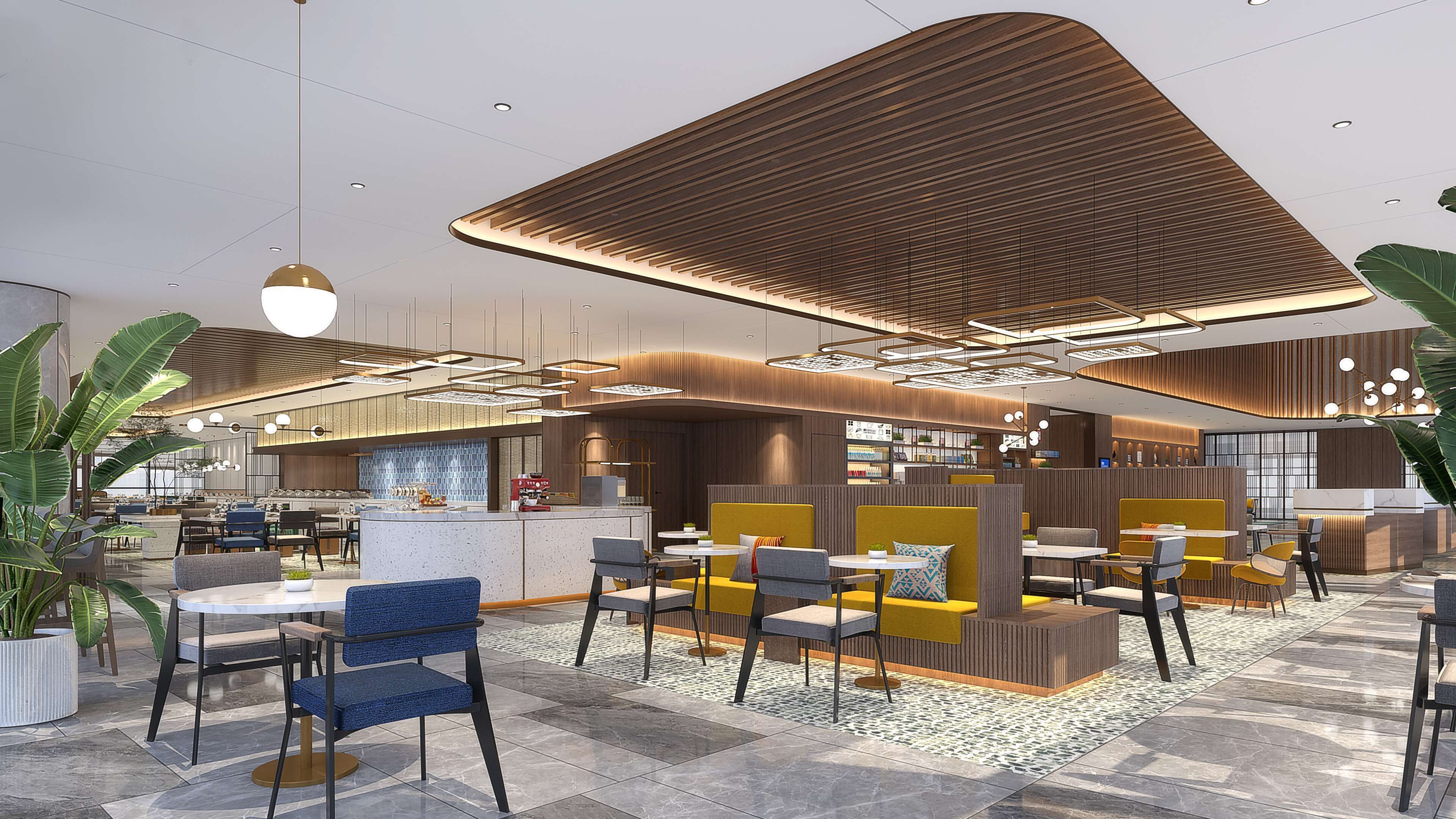 A modern interior with seating areas, a bar, and a kitchen.