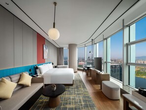 Premium Room, 1 King Bed, River View | Living area | 55-inch LCD TV with cable channels