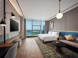 Deluxe Room, 1 King Bed, River View | Living area | 55-inch LCD TV with cable channels