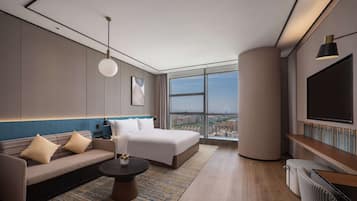 Deluxe Room, 1 King Bed | Living area | 55-inch LCD TV with cable channels