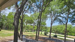 A park with trees, a paved path, and a grassy area. - PENION HOME! HOT TUB FOR 6/7 - SPACIOUS YARD FOR KIDS! (Austin)
