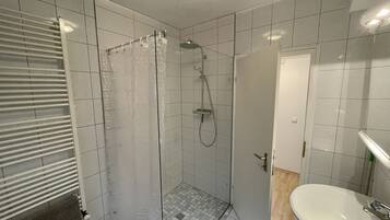 Shower, towels, soap, toilet paper