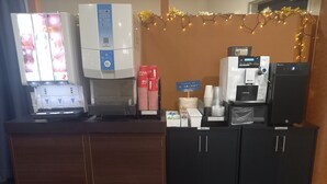 A hotel reception area with a coffee machine, a refrigerator, and a vending machine. - HOTEL C-PLUS - Adults Only (Gyoda)