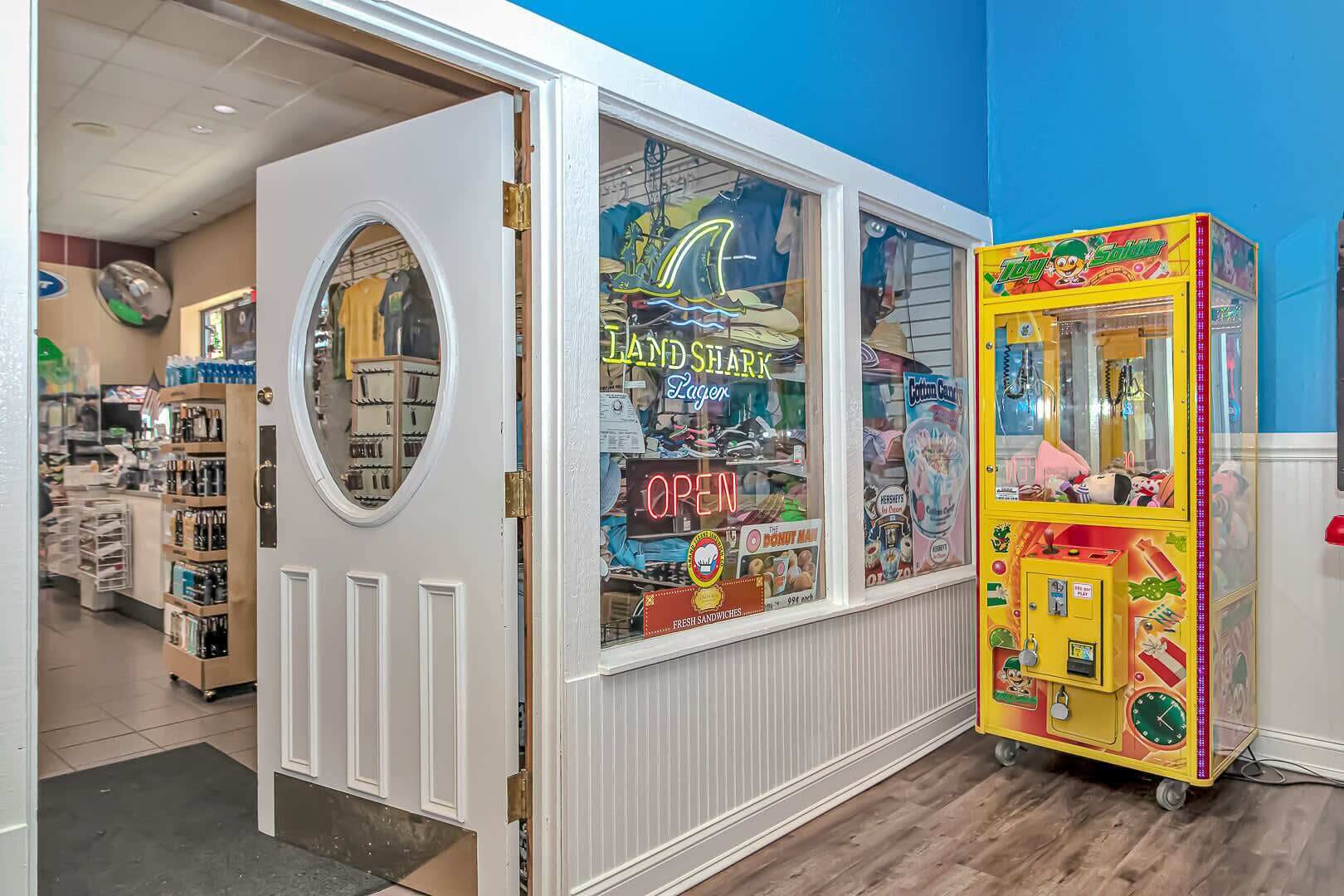 A store with a circular window, a neon sign, and a claw machine.