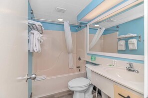 Shower, hair dryer, towels, shampoo