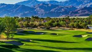 A golf course with a mountain backdrop, sand bunkers, and a clear sky. - PGA West-Catching Sunsets-3bd 2ba in Signature (La Quinta)