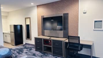 Desk, laptop workspace, blackout drapes, iron/ironing board