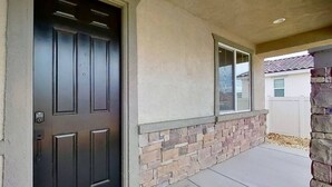 A house with a dark front door, a stone wall, and a window. - The Lancaster Gem!

 (Lancaster)
