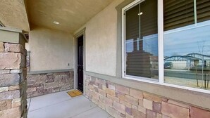 A building exterior with a stone facade, a large window, and a door. - The Lancaster Gem!

 (Lancaster)
