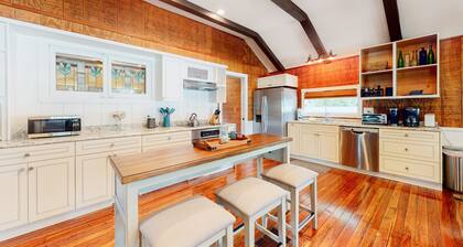 Riverfront dog-friendly cottages with kayaks, dock, patio, grill, & water views