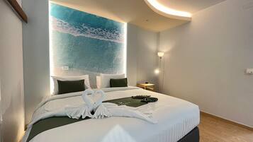 Family Room, 2 Bedrooms | Down comforters, free minibar items, desk, laptop workspace