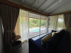 Grand Room, Balcony, Garden View | Living area | 48-inch LED TV with digital channels - Amataya Wellness (Khlong Thom)