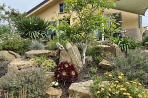 Enjoy a serene outdoor space surrounded by lush greenery and a tranquil atmosphere.