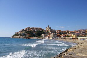 Perched on a hilltop overlooking the coastline, this charming town offers stunning views of the rocky shoreline.
