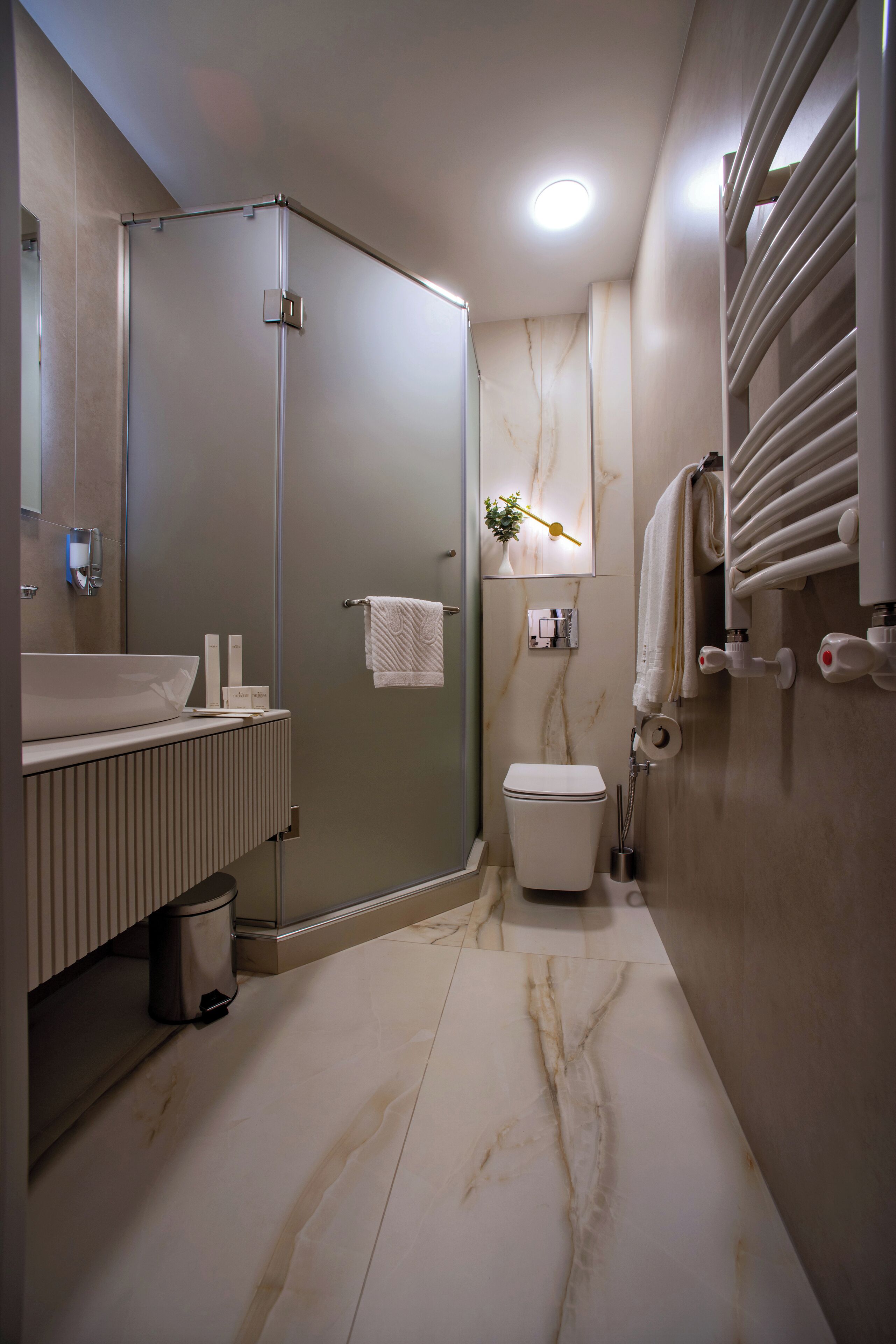 Shower, designer toiletries, hair dryer, bathrobes