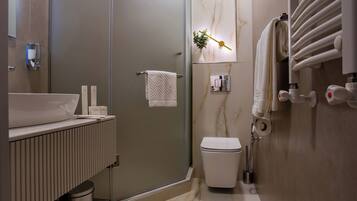 Shower, designer toiletries, hair dryer, bathrobes