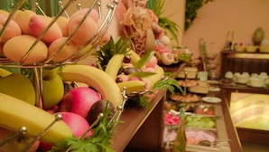 A buffet with various fruits and dishes. - Flora Residence Daisy (Samokov)