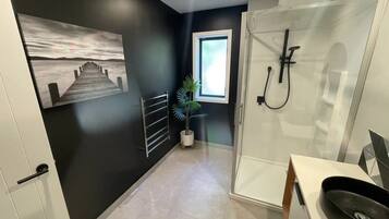 Shower, eco-friendly toiletries, hair dryer, towels