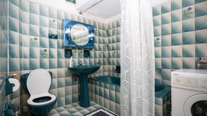 Family Apartment | Bathroom | Hair dryer, towels, toilet paper