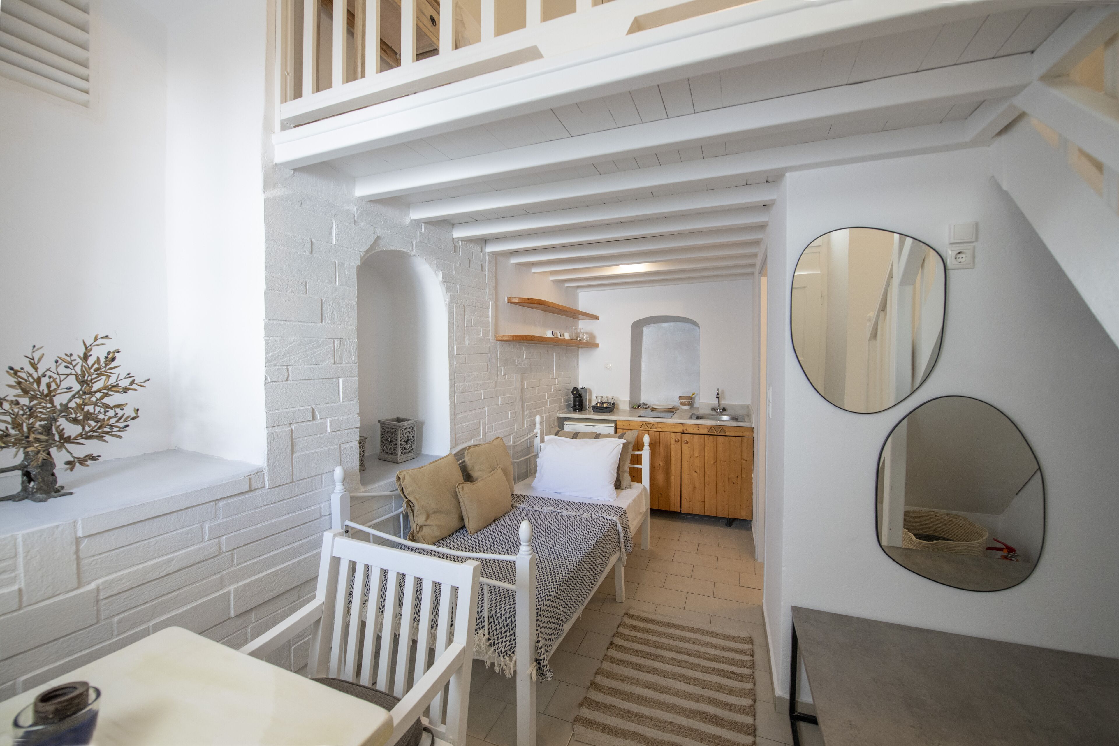 Junior Loft, Pool View | Minibar, in-room safe, individually decorated, individually furnished