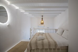 Junior Loft, Pool View | Minibar, in-room safe, individually decorated, individually furnished - Kamara Residence Mykonos (Mykonos)