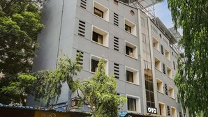 A multi-story building with several windows and balconies.
