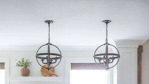 A kitchen with three bar stools, a window, and a hanging light fixture. - Luxury Cottage,  Sleeps 12 , Great Location: minutes to sports complex (Ruston)