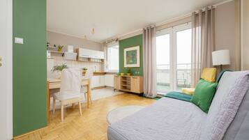 Apartment, 1 Bedroom, Balcony | Living room | 32-inch Smart TV with cable channels