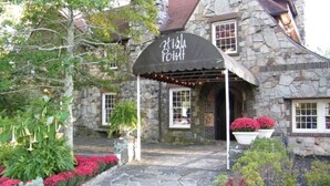 A stone building with a covered entrance labeled "High Point." - NEW! On a WATERFALL! Fiery Gizzard Lodge at Sycamore Falls! 13 bluff acres!  (Tracy City)