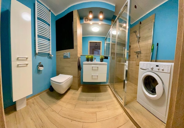 Shower, hair dryer, towels, soap