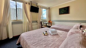 Traditional Room, Multiple Beds | Individually decorated, individually furnished, free WiFi, bed sheets - Nevada Inn (Concepción)