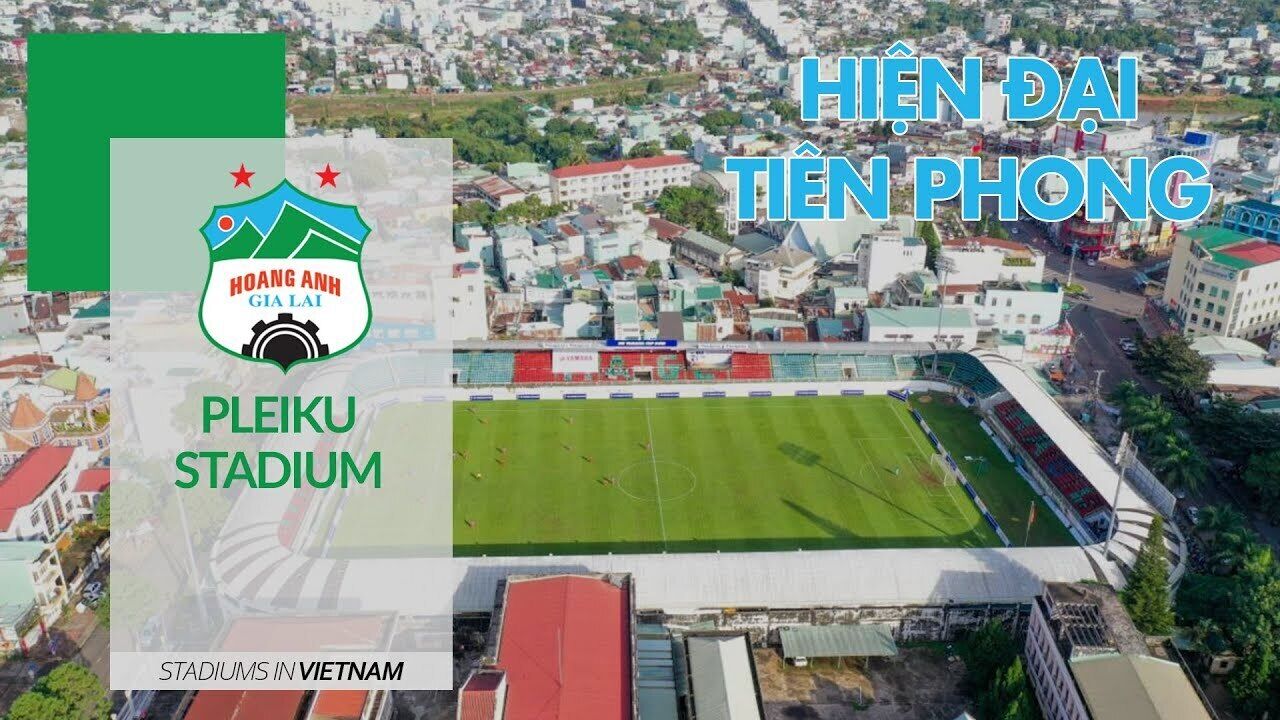 Pleiku Stadium in Vietnam, surrounded by urban buildings.