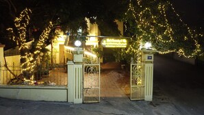 A gated entrance with a sign indicating a hotel or property. - Kim Homestay & Villa (Bai Chay)