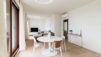 Apartment, Lake View | Living area | 30-inch flat-screen TV with digital channels