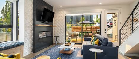 Smart TV, fireplace, books, stereo