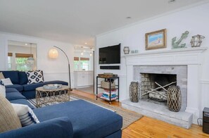 Smart TV, fireplace, books