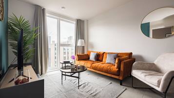 Apartamento, 1 quarto | Área de estar | Smart TV