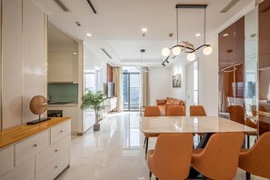 Apartment, 3 Bedrooms | Living area | 45-inch flat-screen TV with cable channels - Vinhomes Central Park Apartment  (Ho Chi Minh City)