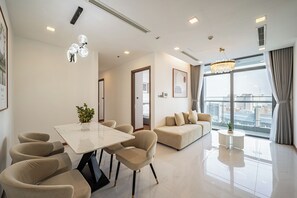 Apartment, 3 Bedrooms | Living area | 45-inch flat-screen TV with cable channels - Vinhomes Central Park Apartment  (Ho Chi Minh City)