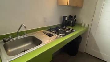 Fridge, microwave, stovetop, coffee/tea maker