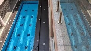 An indoor swimming pool with clear lanes, surrounded by glass railings and a multi-level building structure. - Micasa-Sucasa Hotel and Suites (Port Harcourt)