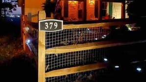 A wooden cabin with a number sign '379' in front. - Breathtaking views amid a “PEACE” of heaven! (Fancy Gap)
