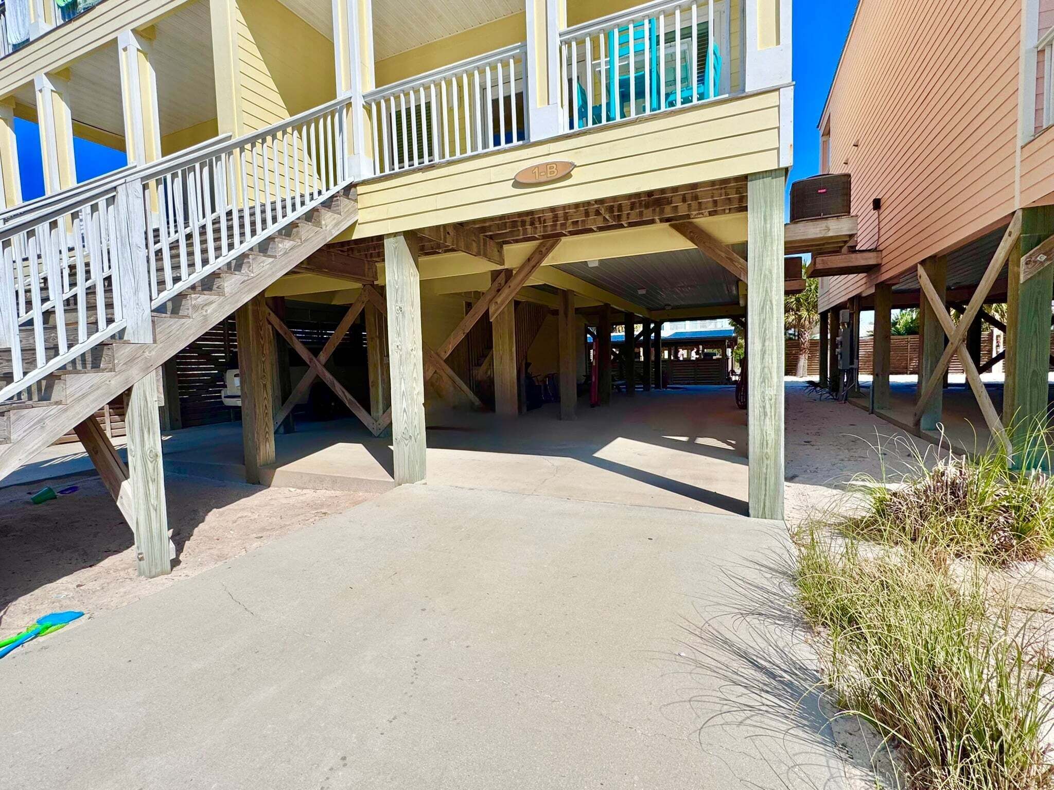 A multi-level building with a covered walkway and a staircase.