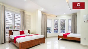A hotel room with two beds, large windows, and a balcony. - Hotel Khánh Linh 2 (Ho Chi Minh City)